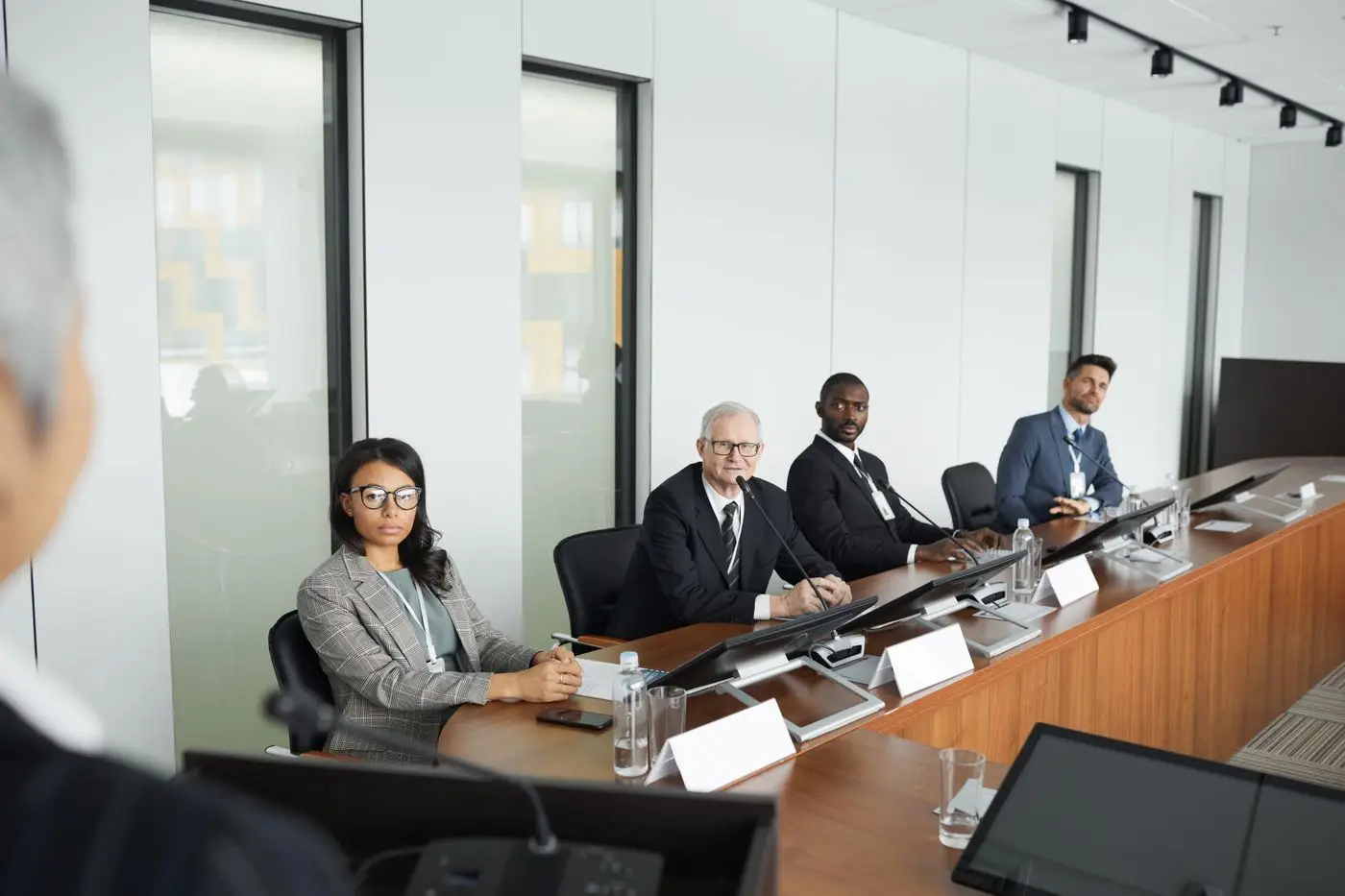 Professionals in discussion around a conference table