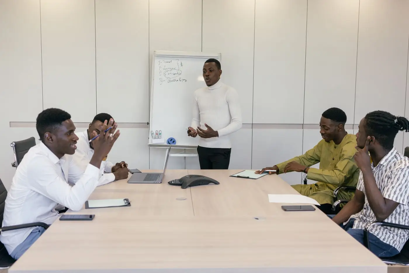 A project team meeting around a boardroom table