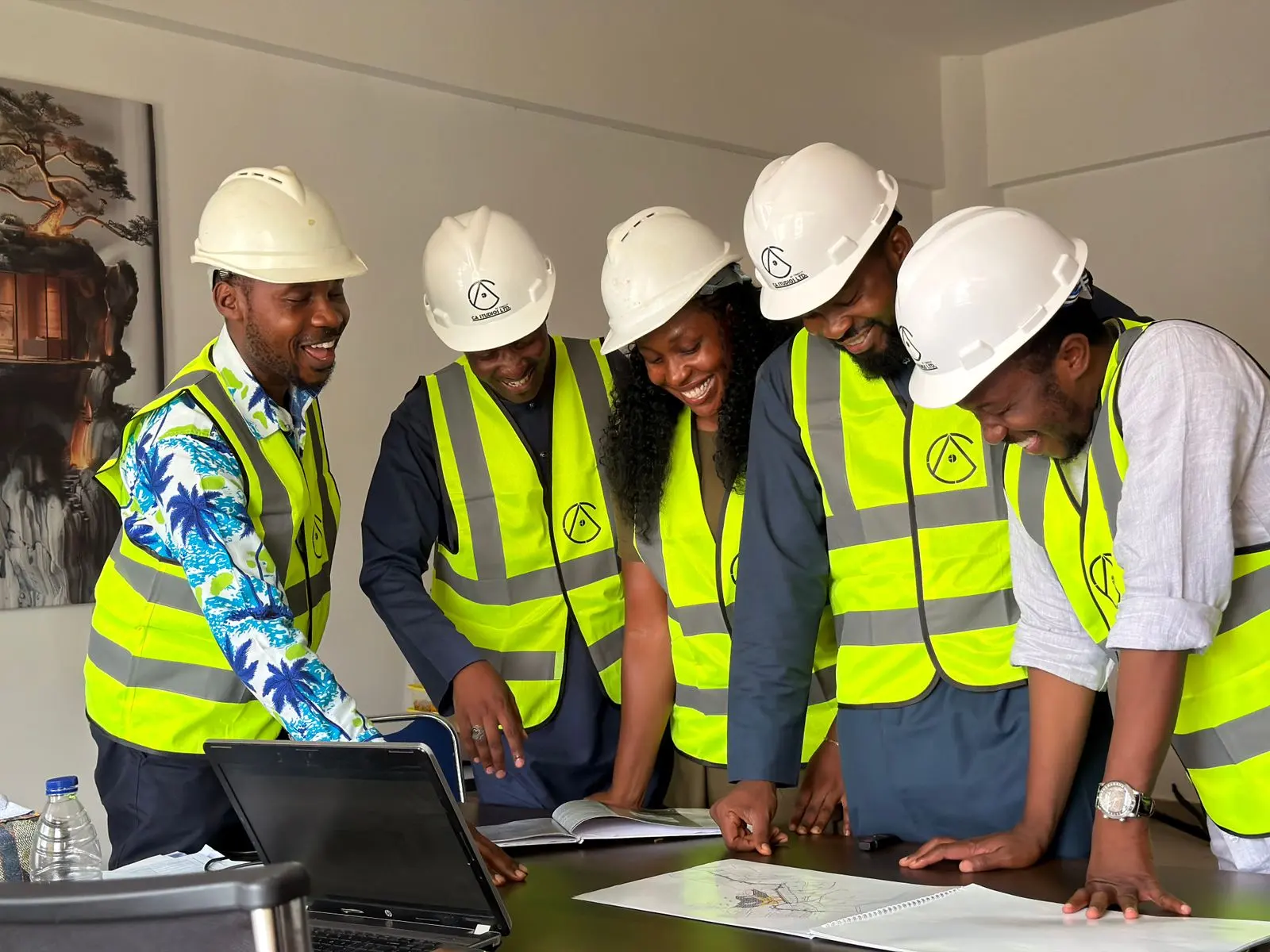 An engineering team reviewing building plans together
