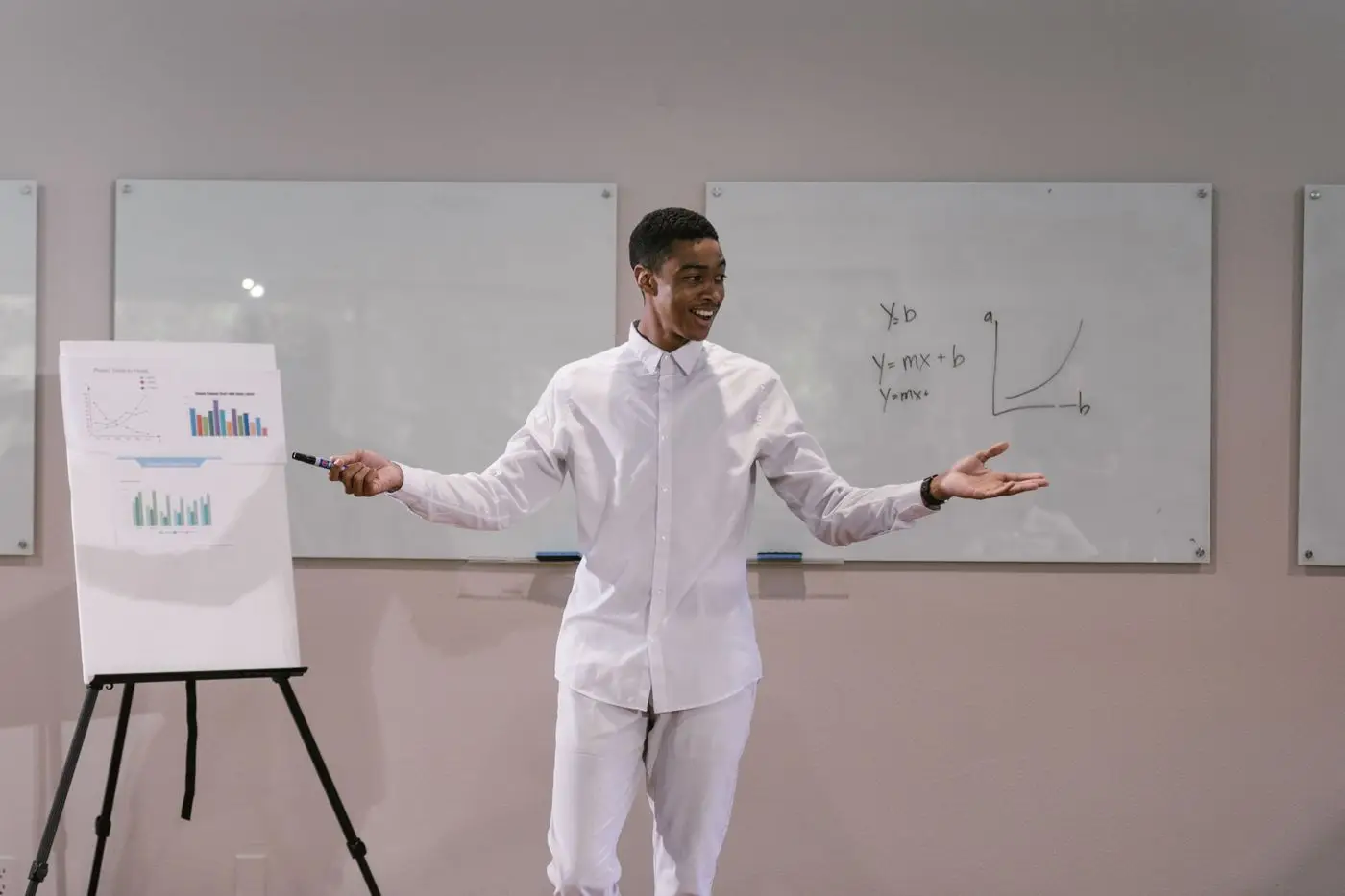 A trainer presenting to a group in a meeting room